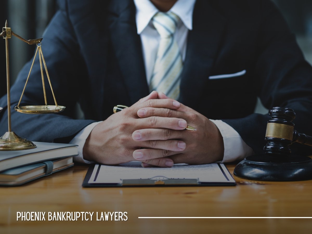 Phoenix bankruptcy attorney at a desk with a gavel and scales of justice